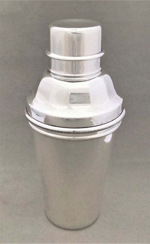 A Rare Silver Plated Cocktail Shaker with Lemon Squeezer