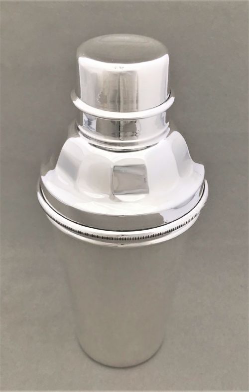 fig 1. A rare silver plated cocktail shaker with lemon squeezer