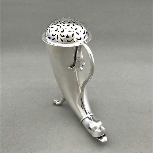 fig 1. An outstanding Irish silver 'cornucopia' silver sugar caster