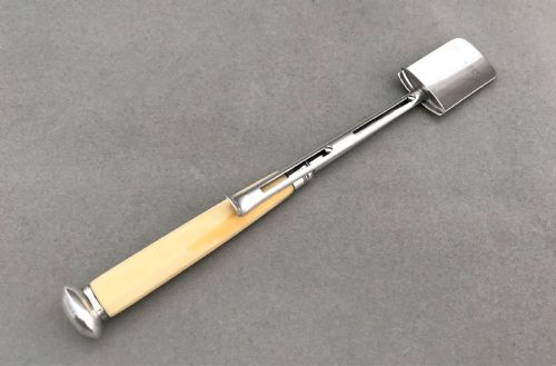 fig 1. A wonderful Georgian silver stilton scoop with 'push release' mechanism