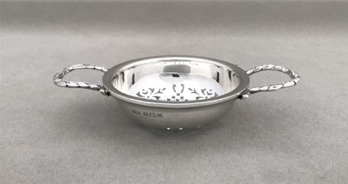 fig 1. An attractive silver tea strainer