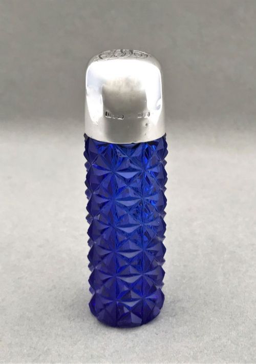 A Stunning Victorian Silver Mounted Scent Bottle