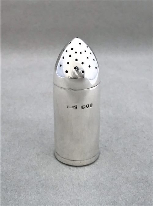 fig 1. A rare novelty silver 'shell' pepper pot