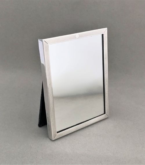 An Unusual Engine Turned Silver Travelling Mirror