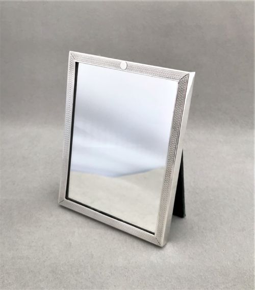 fig 1. An unusual engine turned silver travelling mirror
