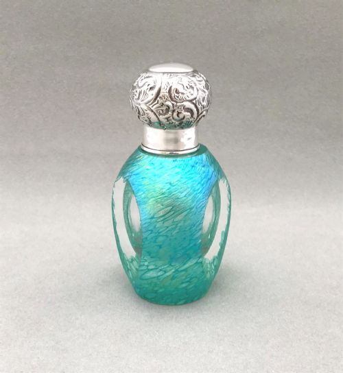 A Superb Edwardian Silver Mounted Iridescent Scent Bottle