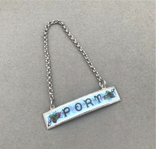 An Unmarked Silver & Enamel Port Decanter Label
