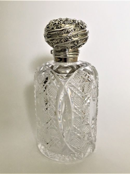 A Gorgeous Victorian Silver Mounted Cologne Bottle