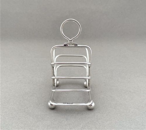 fig 1. A lovely novelty silver breakfast tray toast rack