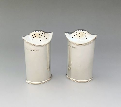 A Stylish Pair of Asprey & Co. Chester Silver Pepper Pots