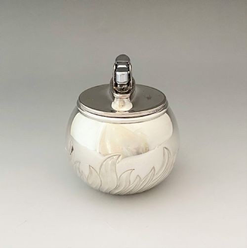 fig 1. A stylish silver 'witch ball' table lighter by Comyns