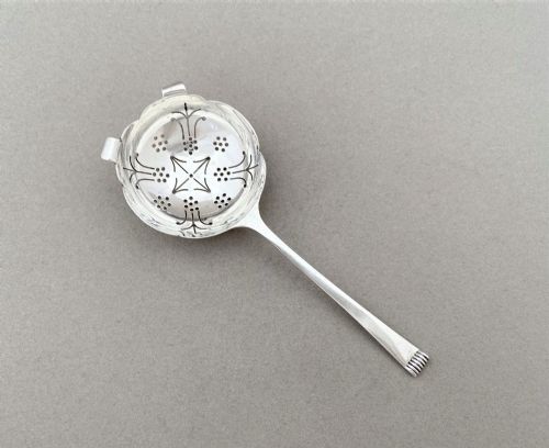 A Fine Silver Tea Strainer in the Art Deco Taste