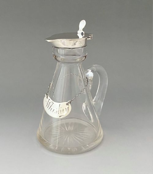 A Superb Silver Mounted Whisky Tot and Matching Silver Label