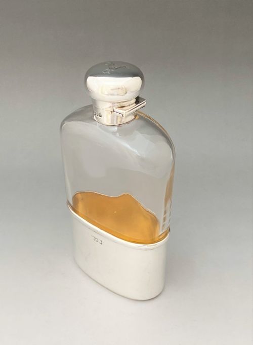 fig 1. A handsome Edwardian silver mounted hip flask with Greyhound armorial