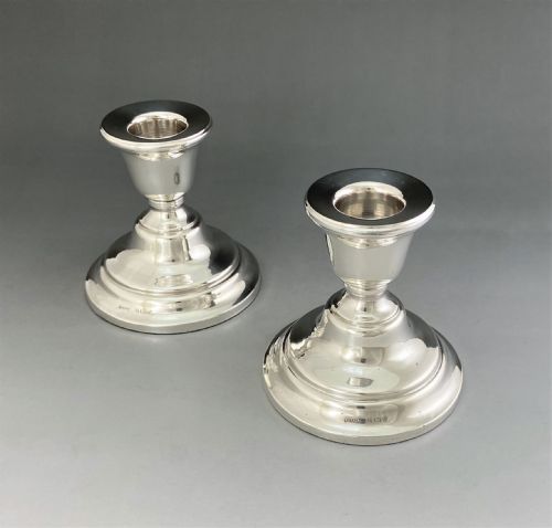 A Stylish Pair of Dwarf Silver Candlesticks
