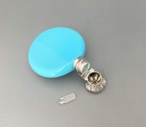 fig 1. A Victorian silver mounted blue opaline 'penny' scent bottle