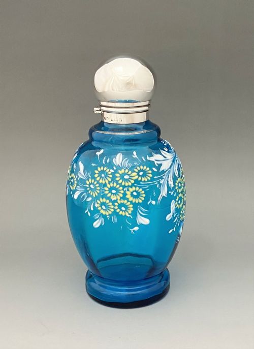 A Stunning Edwardian Silver Mounted Cologne Bottle