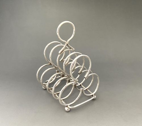 An Attractive Edwardian Four Slice Silver Toast Rack