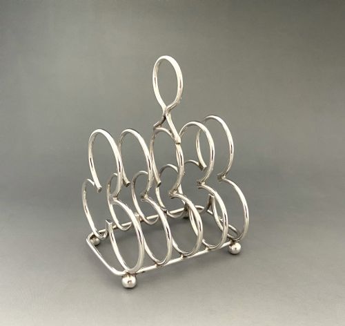 fig 1. An Attractive Edwardian four slice Silver Toast Rack