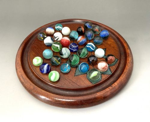 fig 1. An attractive Victorian Solitaire board & glass marbles