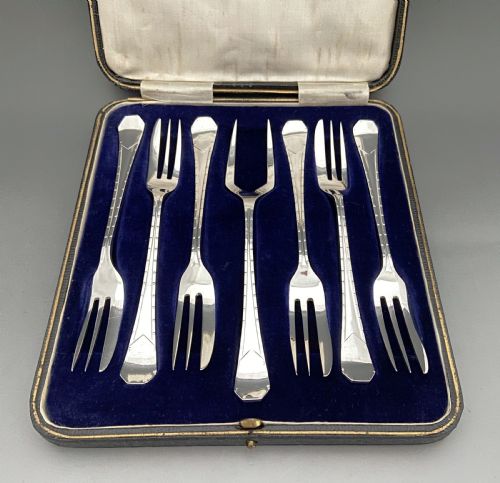 An Excellent Boxed Set of Six Silver Cake Forks & Serving Fork