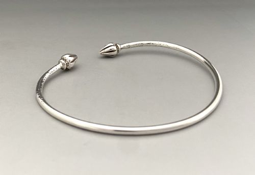 fig 1. A versatile early 20th Century silver torque bangle