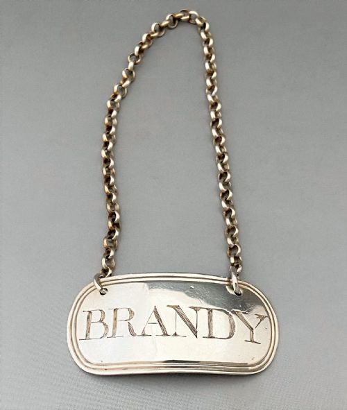 fig 1. A silver Brandy label by Female silversmith - Elizabeth Morley