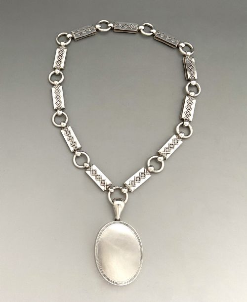 fig 1. An unusual late Victorian silver neck chain & locket