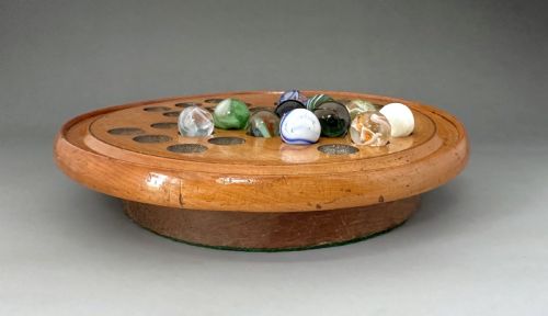 fig 1. An attractive Victorian Solitaire board & glass marbles