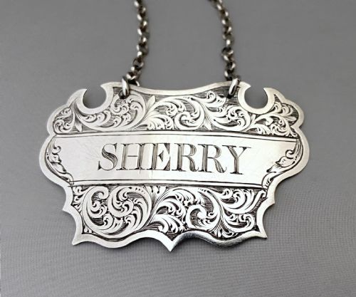 fig 1. An attractive pair of Scottish silver decanter labels