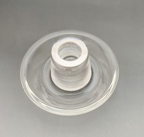 fig 1. An Edwardian clear glass match striker featuring a ribbed cylindrical body, wide saucer base, and a hallmarked sterling silver collar holding red-tipped matches.