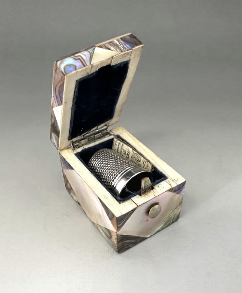 A Delightful Victorian Mother-of-pearl Thimble Box & Silver Thimble