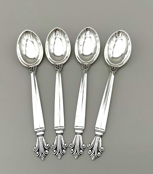 fig 1. A set of four Danish sterling silver teaspoons with decorative carved scroll handles.