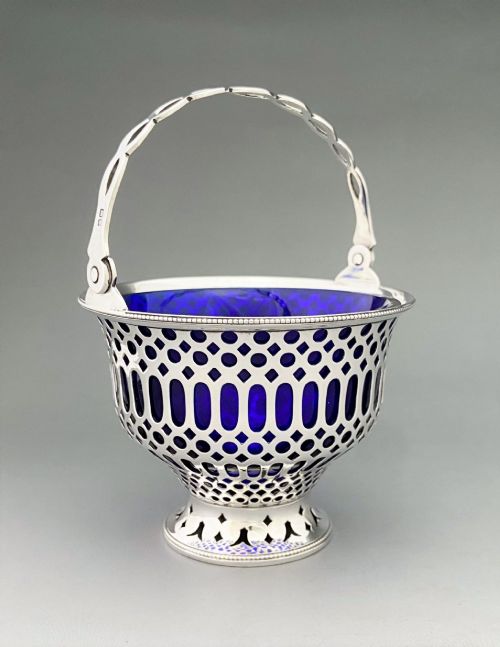 A GORGEOUS PIERCED CHESTER SILVER SWING HANDLED BASKET