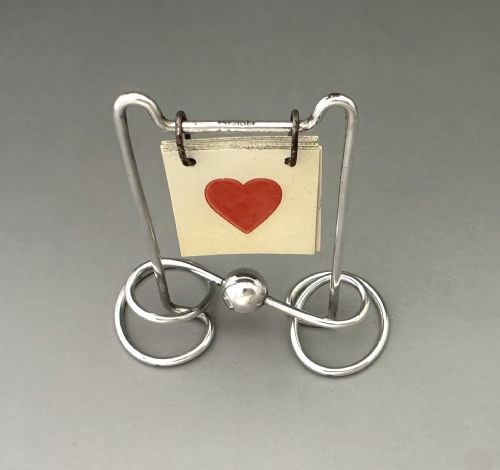 A DELIGHTFUL SILVER PLATED TRUMP MARKER - ADDITIONAL PHOTO 1