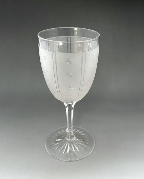 fig 2. A set of six clear Victorian glass goblets, each featuring distinct hand-etched and cut geometric and floral patterns.