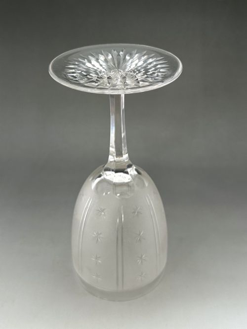 fig 3. A set of six clear Victorian glass goblets, each featuring distinct hand-etched and cut geometric and floral patterns.
