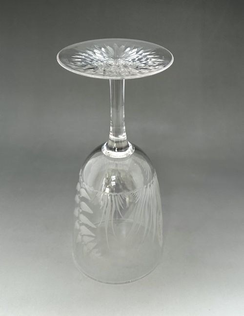 fig 5. A set of six clear Victorian glass goblets, each featuring distinct hand-etched and cut geometric and floral patterns.
