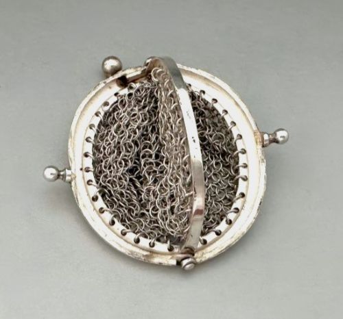 A petite French silver chainmail purse featuring a curved kiss-clasp frame and small silver spherical drops attached along the bottom seam. View IV