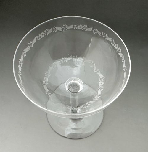 fig 4. A harlequin set of six antique clear glass champagne coupes featuring various hand-etched geometric and floral patterns.