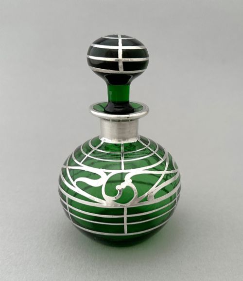 A wonderful Art Nouveau silver overlay glass scent/ perfume bottle