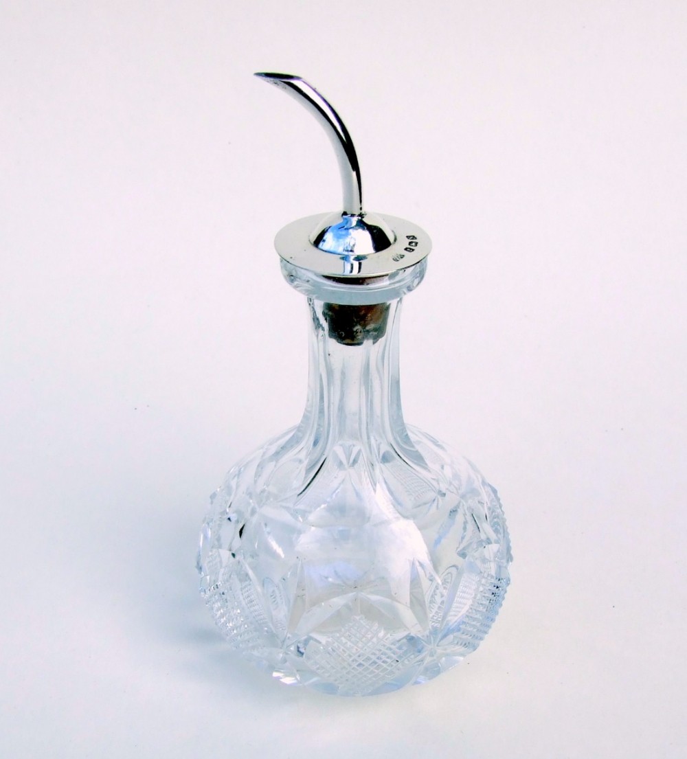 An unusual silver mounted bitters jigger.