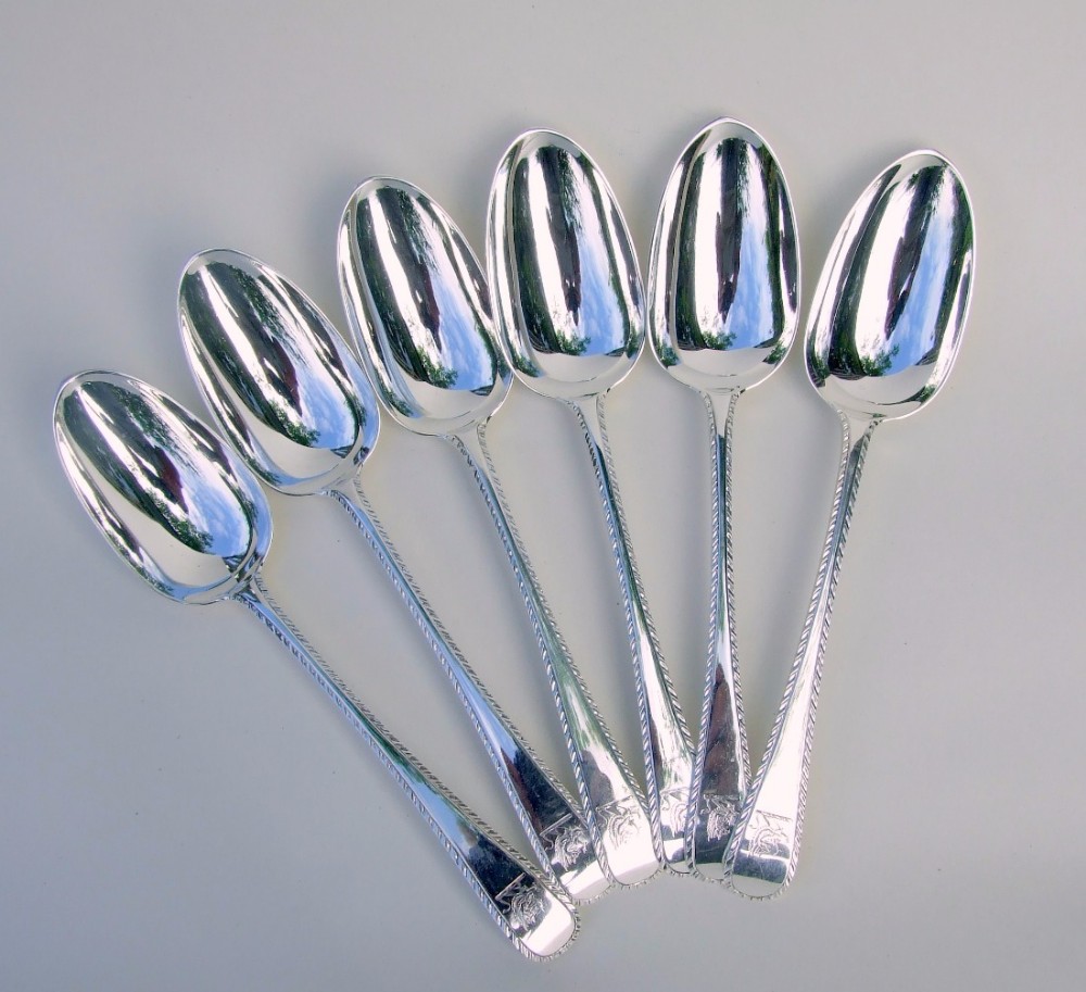 A spectacular set of six Britannia standard silver serving spoons.
