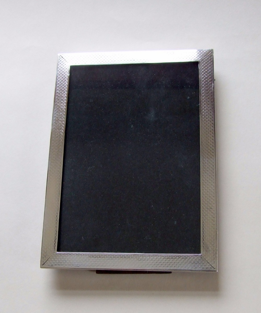 Rectangular Art Deco engine turned silver photo frame.