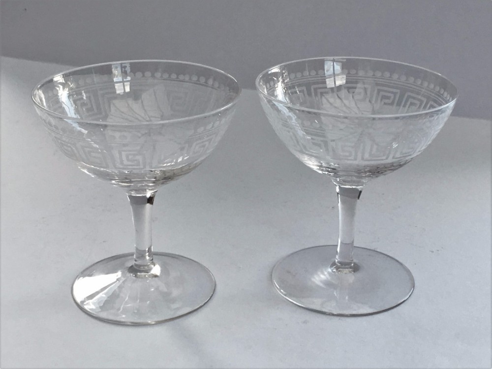 A LOVELY PAIR OF LATE VICTORIAN GREEK KEY ETCHED CHAMPAGNE BOWLS.