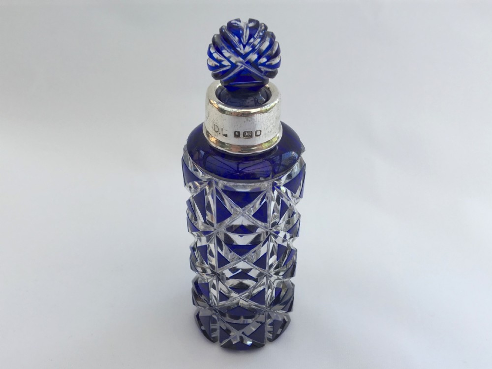 A splendid silver mounted overlay perfume bottle with original stopper