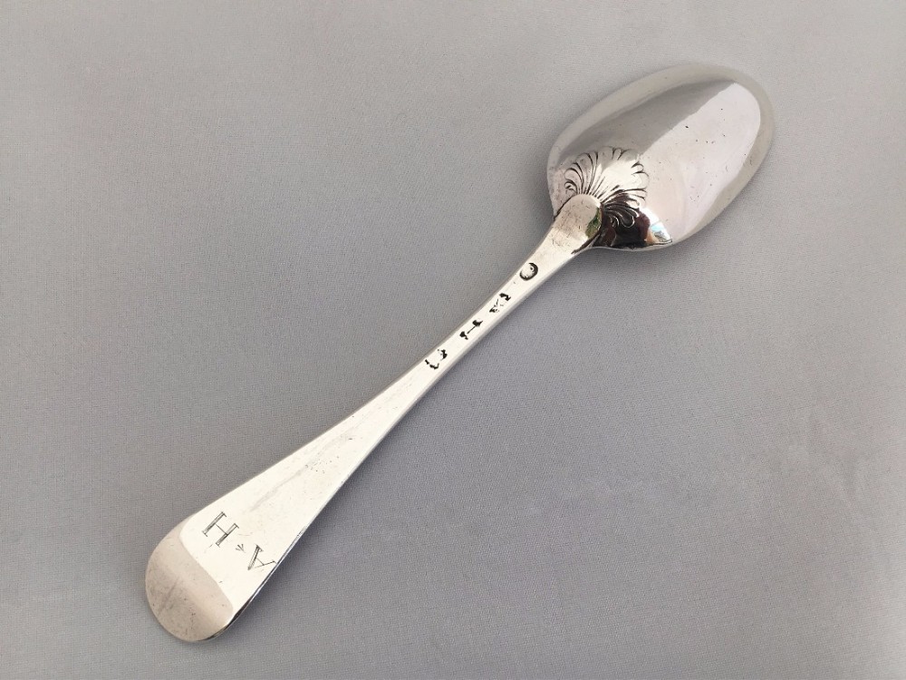 A fabulous and rare mid 18th century silver shell back serving spoon - Female silversmith