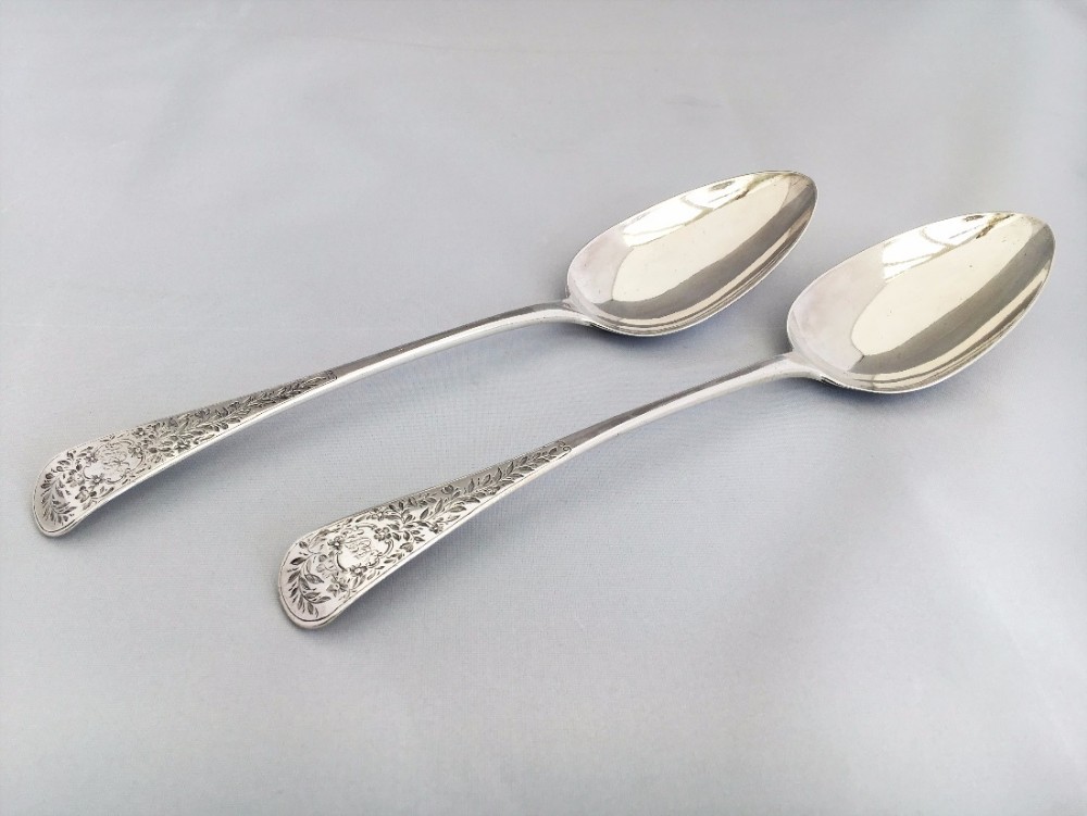A splendid pair of George III silver serving spoons.