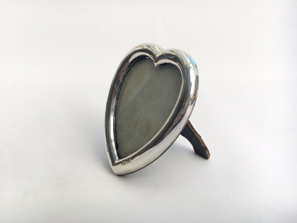 A lovely late Victorian heart shaped small silver photo frame.