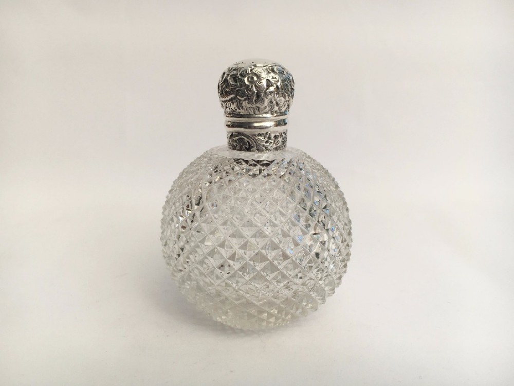 A gorgeous silver mounted Victorian cologne bottle.